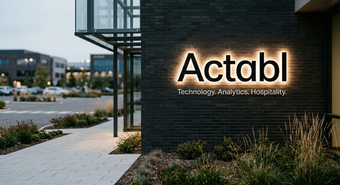 A modern building exterior featuring a sign for a company named Actabl.