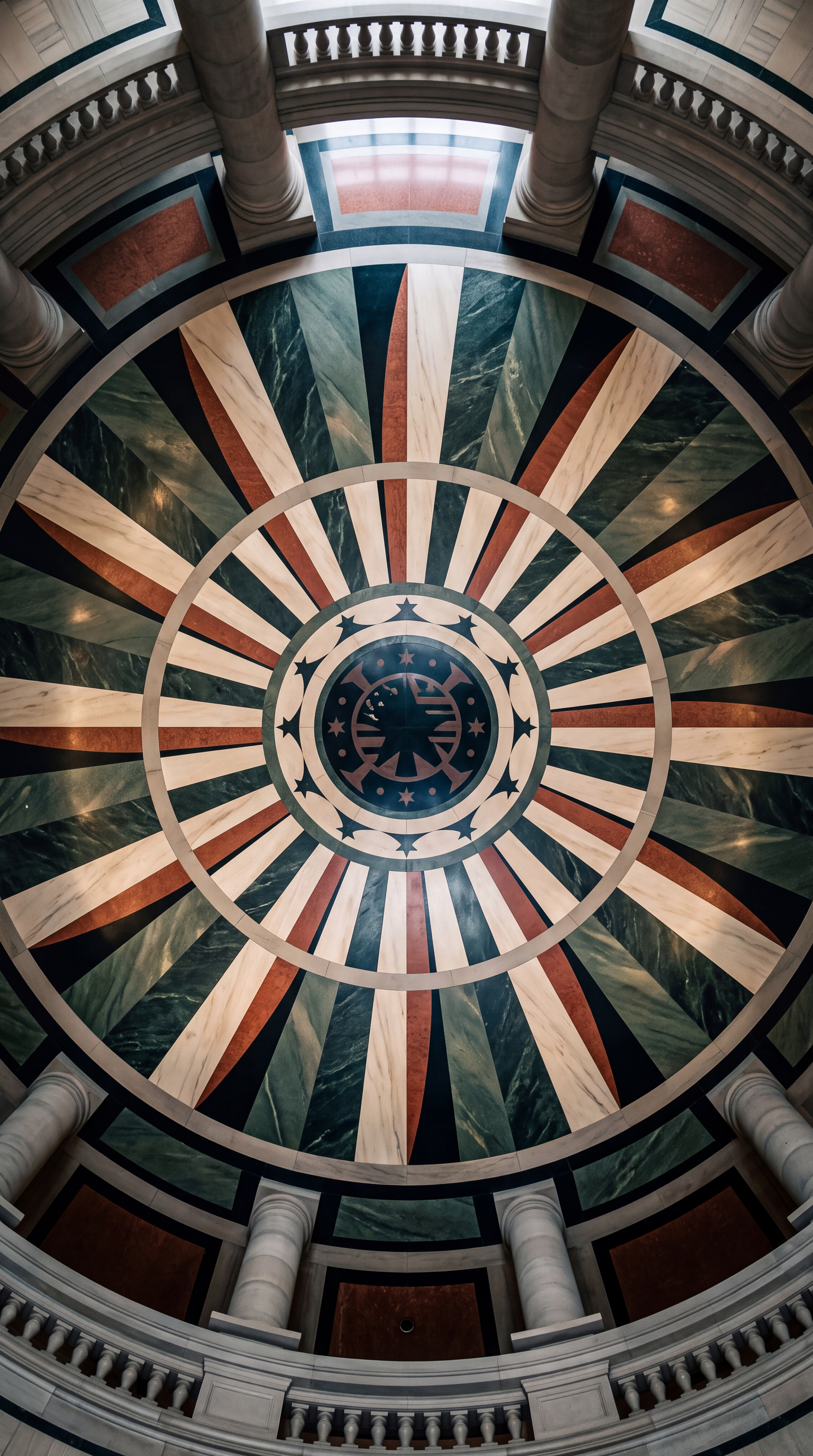 The image shows a decorative ceiling with a starburst pattern and intricate designs.