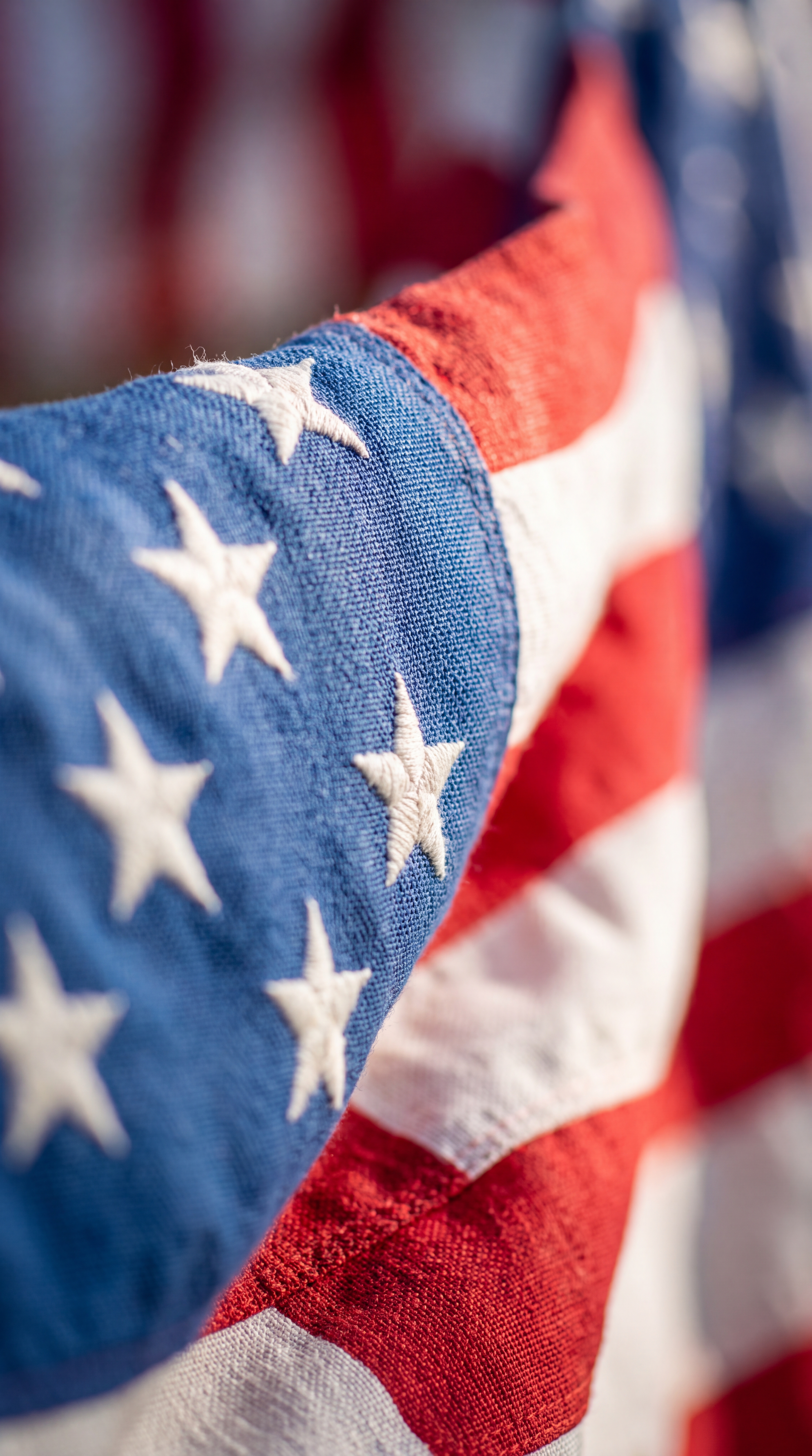 A close-up of the American flag showing its red, white, and blue colors.