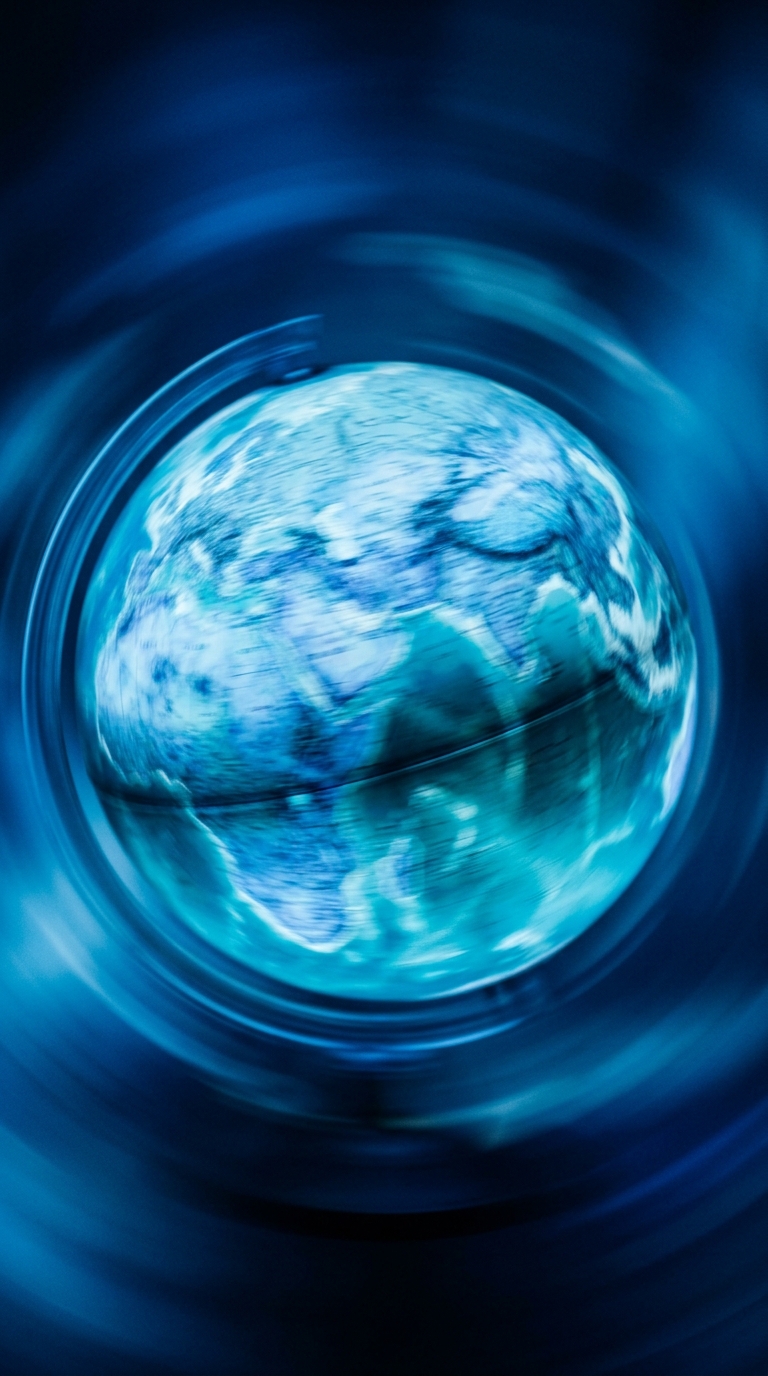 A blurred representation of the Earth in blue tones.